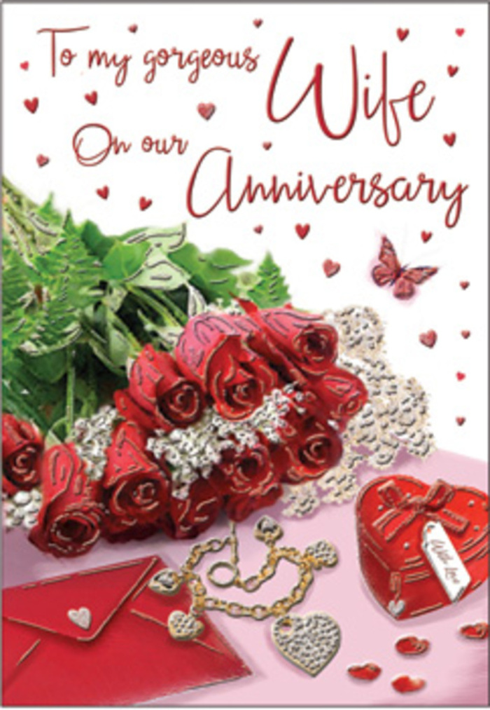 In this richly composed anniversary image, a bouquet of classic red roses takes centre stage, arranged with the same care you might expect from a trusted Shooter's Hill florist preparing a special delivery. Each bloom is luxuriously full, its petals layered in deep crimson tones that move from dark, shadowed centres to lighter, almost glowing edges. The roses are gathered together with lush green foliage, the leaves curving gently outward to create a sense of abundance and natural movement, as though the bouquet has just been set down after a stroll back from a local flower shop near Shooters Hill Road. Soft, whisper-thin lace details and delicate heart motifs frame the scene, adding a touch of vintage romance, like cherished keepsakes taken from a treasured box. Nestled alongside the flowers are symbols of long-lasting devotion: a refined jewellery set glinting faintly in the light, and a vivid red gift box whose smooth, satin-like finish hints at a lovingly chosen surprise inside. The background shimmers subtly, evoking fabrics like velvet and silk, while threads of gold tones weave through the accessories, suggesting years of shared anniversaries and thoughtful gestures. The card's scripted message is visible but not dominant, its flowing letters joining the roses and trinkets in one cohesive composition. Soft, even lighting bathes the entire arrangement, avoiding harsh shadows and instead creating a warm, enveloping glow that feels like a gentle embrace. The atmosphere is unmistakably romantic, reminiscent of cosy evenings at home overlooking the greenery of Oxleas Wood, where every glance at the card recalls memories, promises kept, and a love that has grown deeper with each passing year.